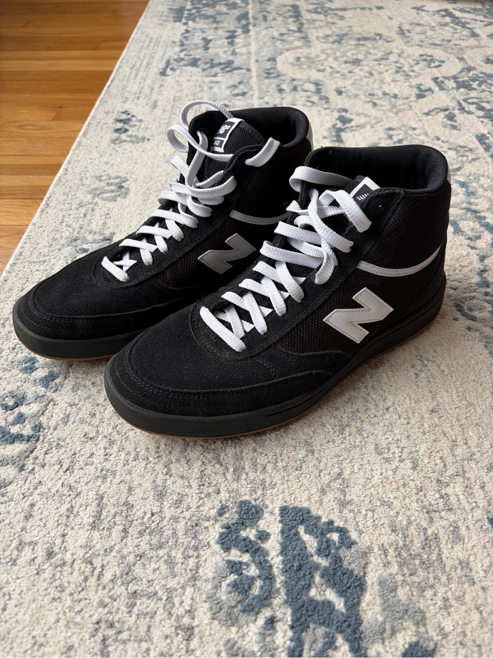 New Balance Black and White High-Top Sneakers